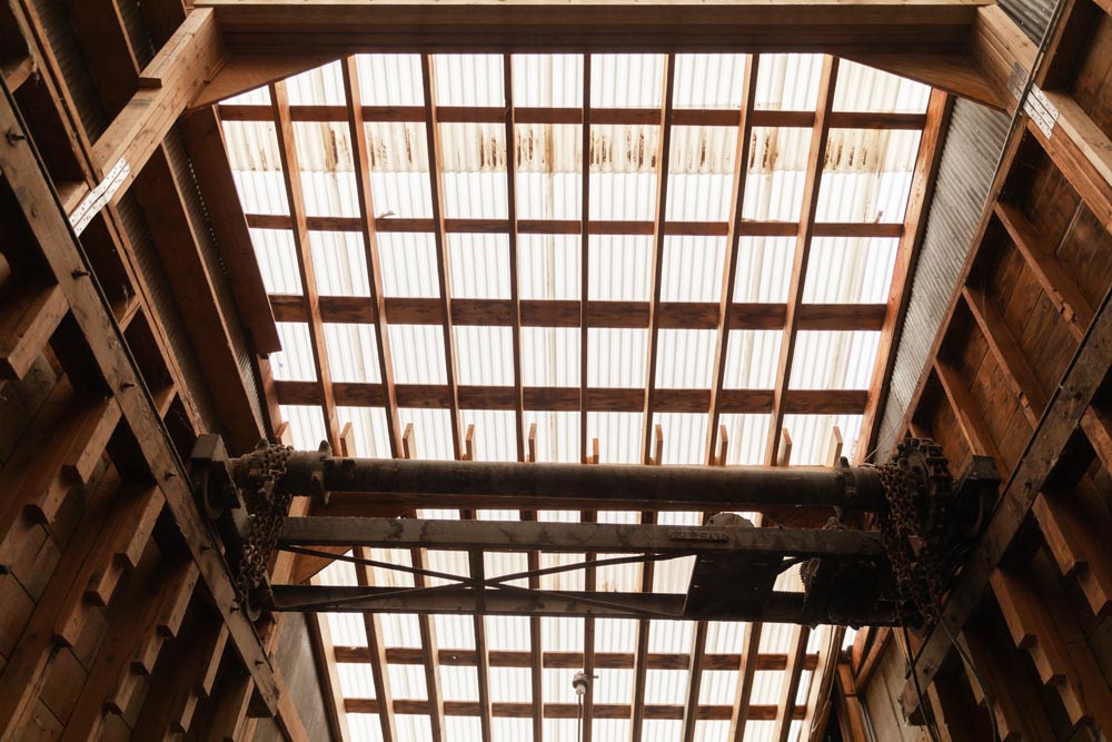 Ceiling view of 2x4 and chains in the Historic Hayden Granary.