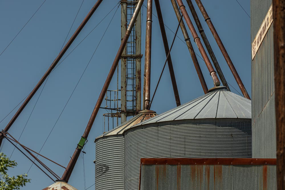 Detail shot of stacks with blue sky in the background.