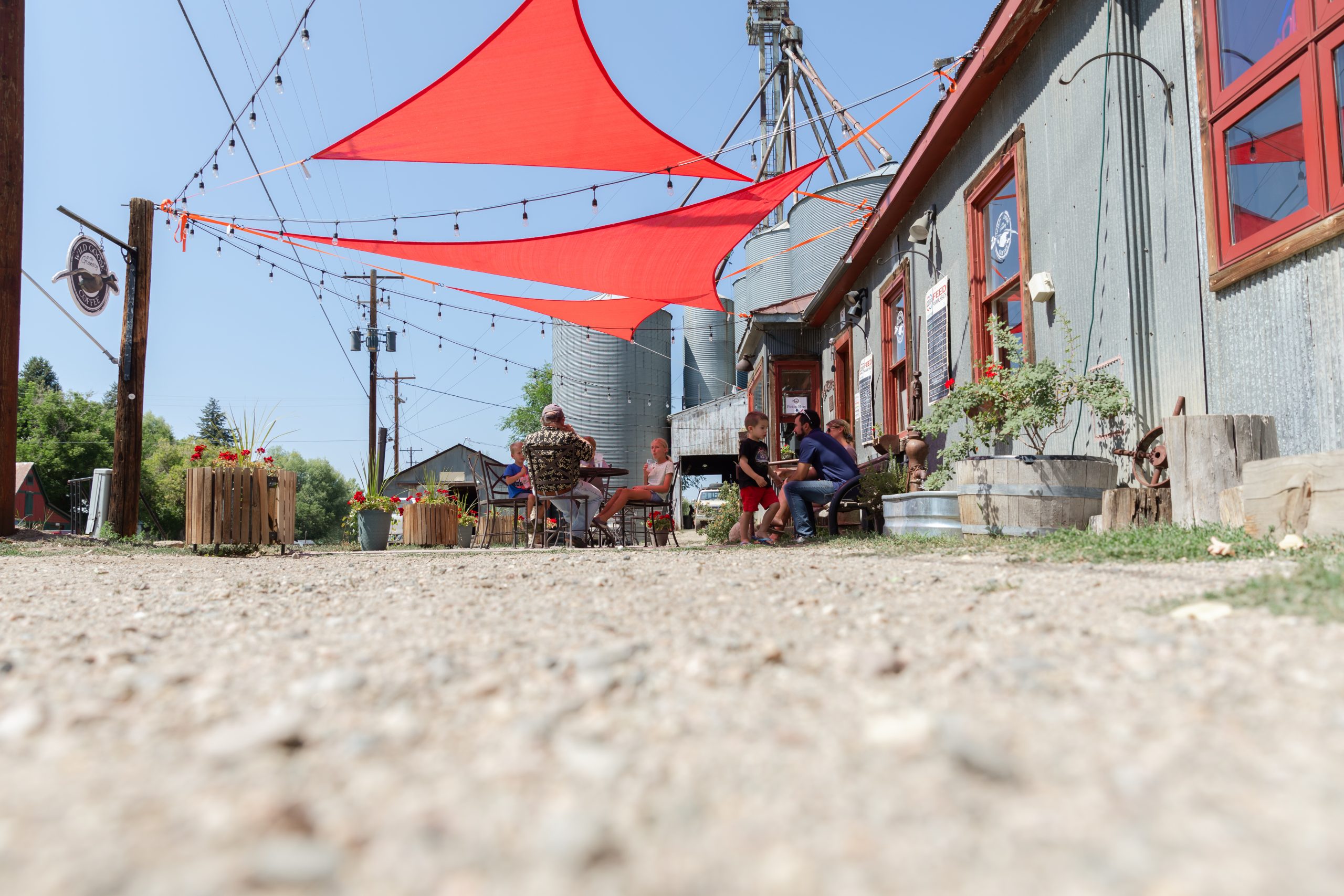 Patrons on the patio outside of Wild Goose Coffee enjoying the day.