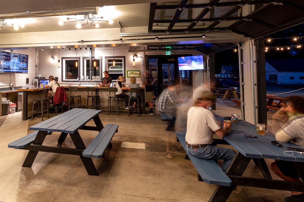People enjoying beer inside Yampa Valley Brewing at the Historic Hayden Granary