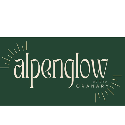 Glowing woodfired Pizza oven cooking pizza at Ember inside the Hayden Granary.