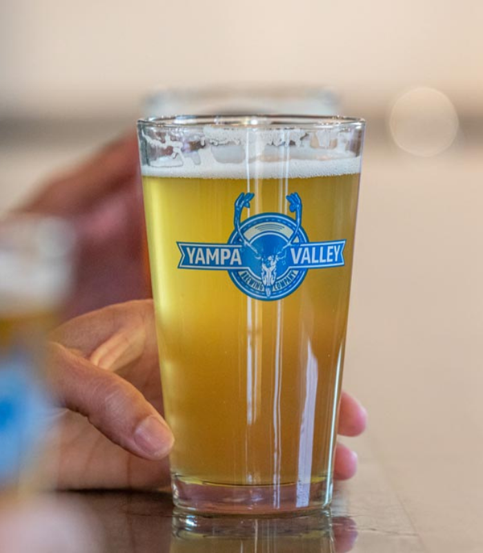 Detailed shot of expresso machine brewing expresso at the Wild Good Coffee shop.